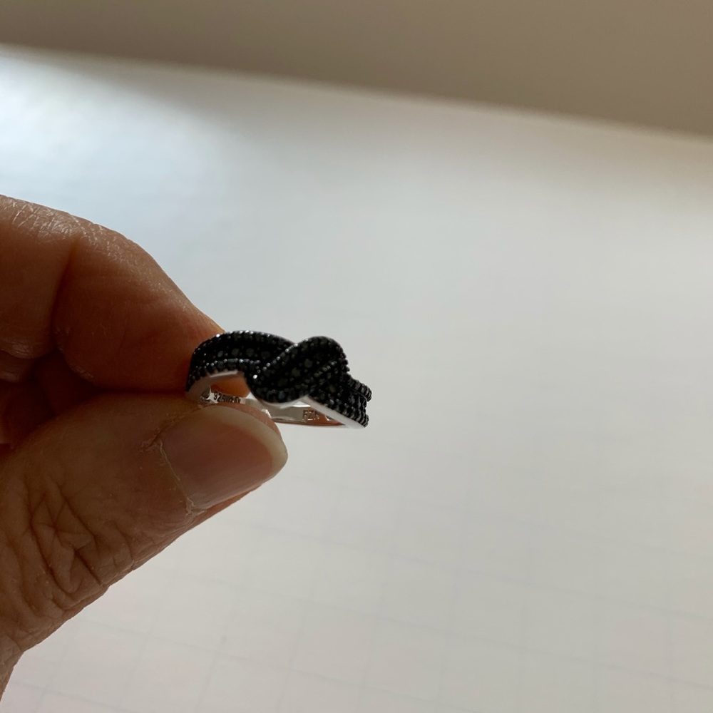 Size 6 Black Spinel Crossover Ring.